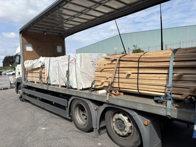 Timber load secured on flatbed