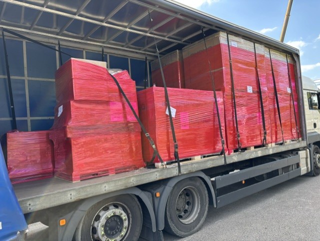 Palletised red cargo loaded